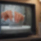 Close-up of a television screen being cleaned with wipes