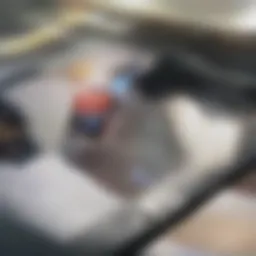 A bottle of Dawn dish soap and a bottle of vinegar on a kitchen counter