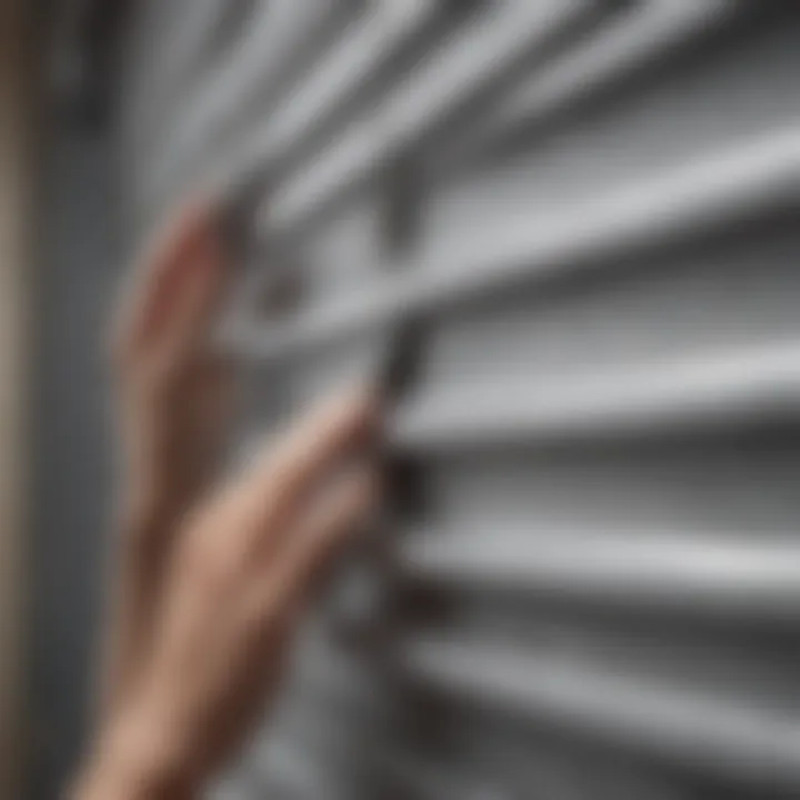 Example of a person using a damp sponge to wipe down aluminum blinds