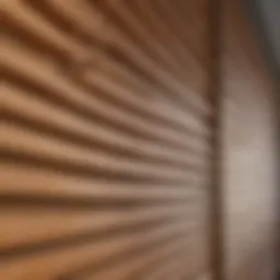 Close-up view of wooden blinds being cleaned with a microfiber cloth
