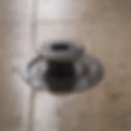 Close-up view of a shower drain clogged with hair