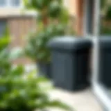 Compact Compost Bin on an Apartment Balcony A compact compost bin on a balcony with greenery around.