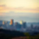 A panoramic view of Denver's skyline with surrounding mountains