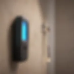 A digital stud finder displaying readings on a wall.