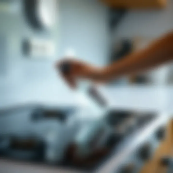 A person applying a cleaning solution to the glass stove top.
