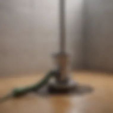 Tools for unclogging a shower drain including a plunger and snake