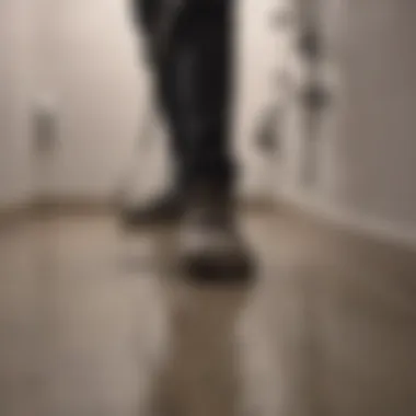 Professional plumber assessing a shower drain issue in a bathroom