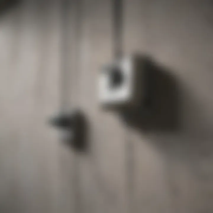 Close-up of hardware used for hanging art on concrete