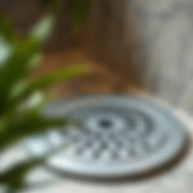 Close-up of modern shower drain cover with unique design