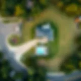 Aerial view showcasing the contrast between a large lot and a compact house.